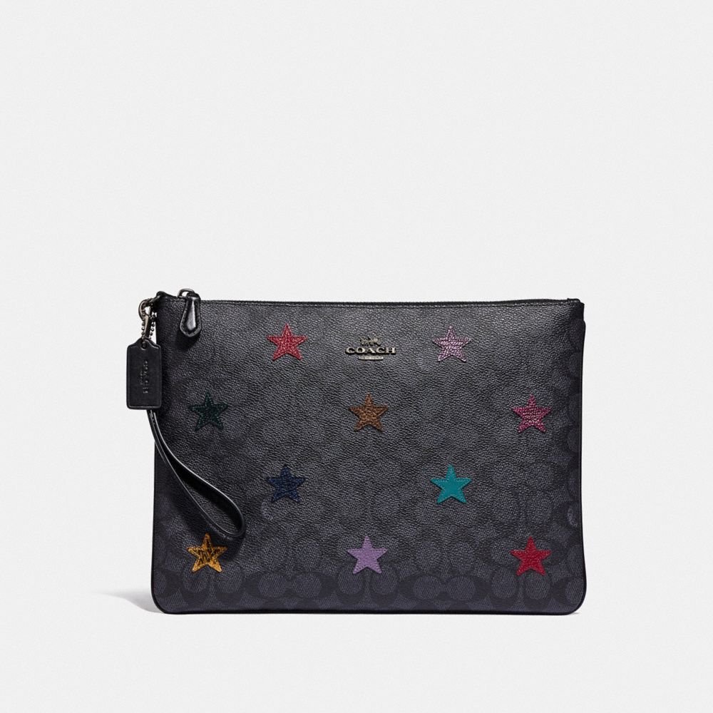 LARGE WRISTLET 30 IN SIGNATURE CANVAS WITH STAR APPLIQUE AND SNAKESKIN DETAIL