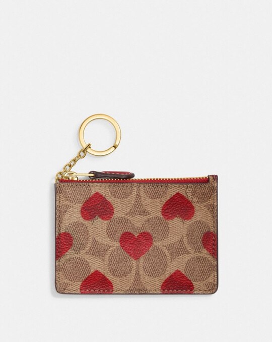 MINI SKINNY ID CASE IN SIGNATURE CANVAS WITH HEART PRINT